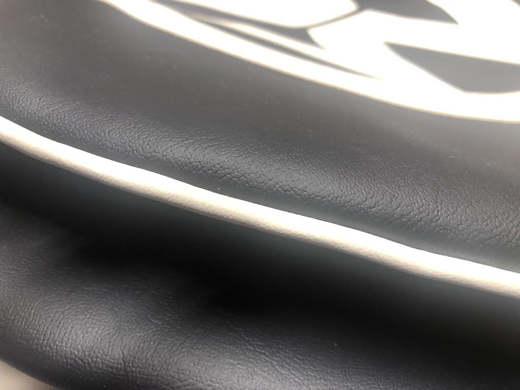 Spare wheel cover in Black with white logo.