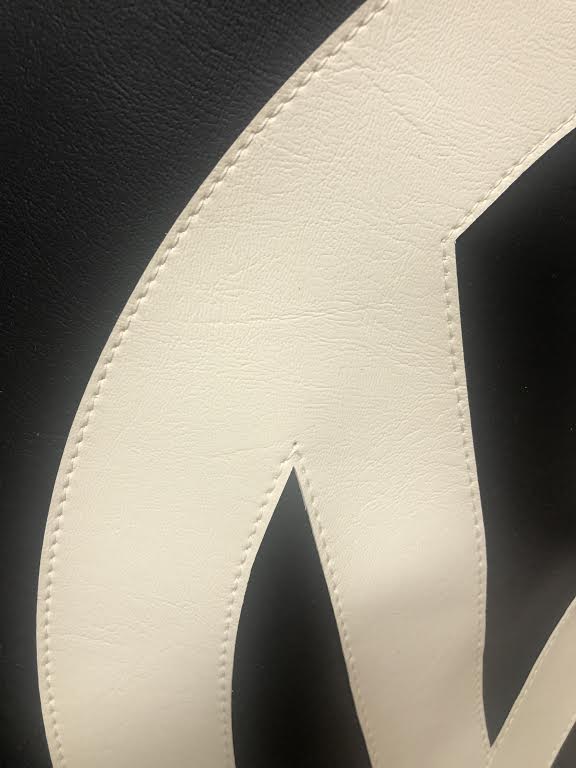 Spare wheel cover in Black with white logo.