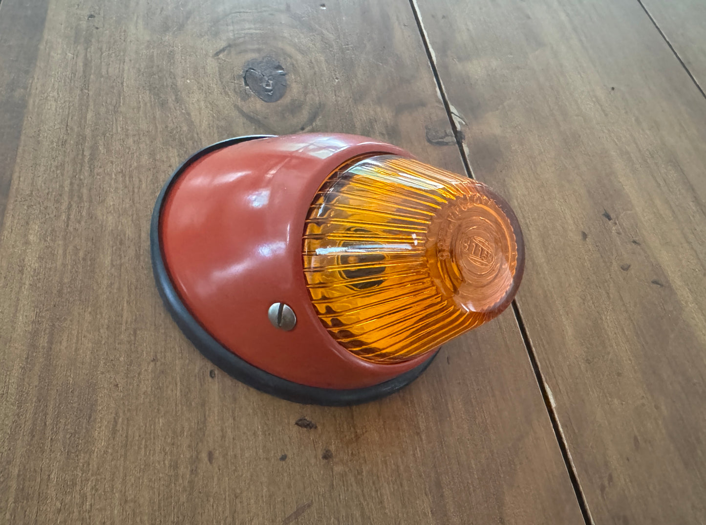 Bullet turn signal indicator units with orange Hella lenses.