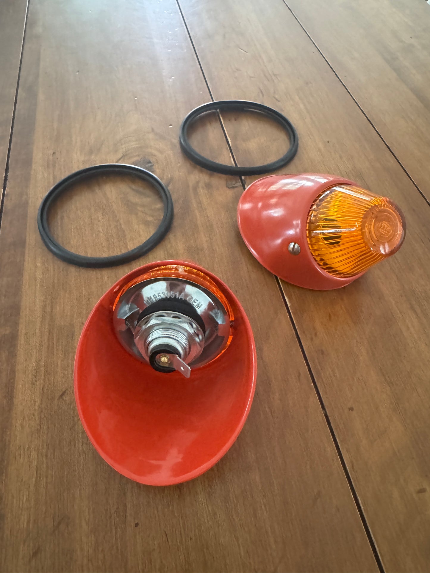 Bullet turn signal indicator units with orange Hella lenses.