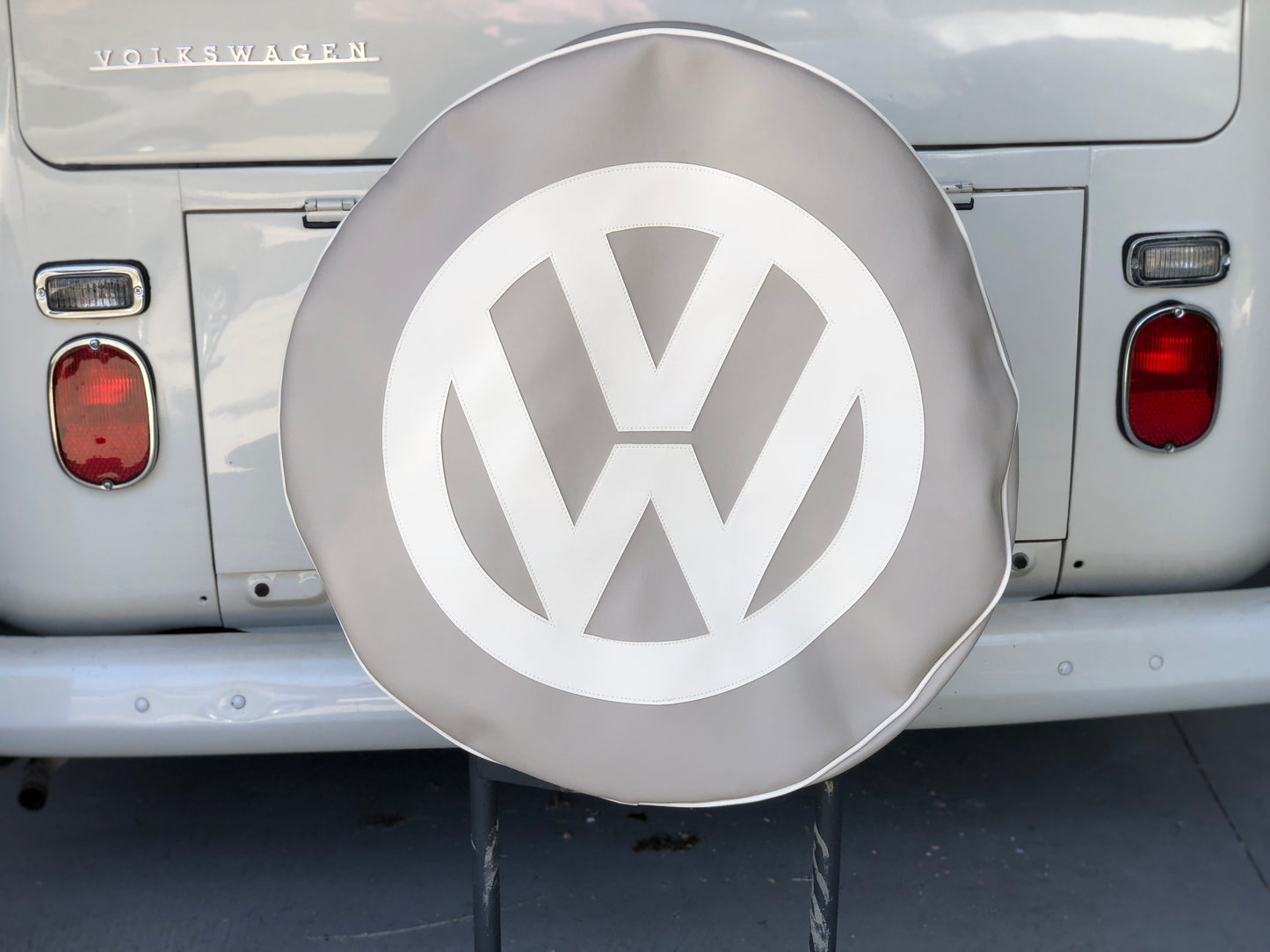 Spare wheel cover in sand surf with white logo.